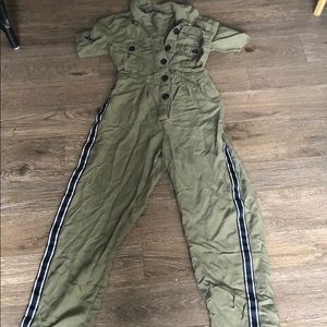 Olive green jumpsuit striped detail legs